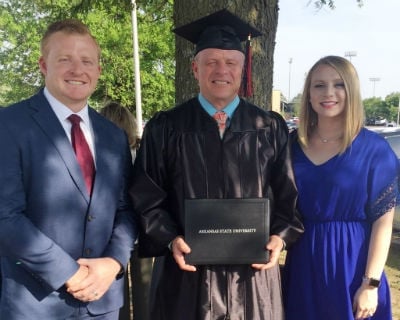 A-State online BGS graduate John Foster with his kids