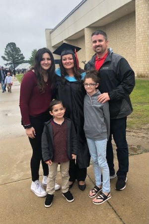 A-State graduate Marcia Correia with her family